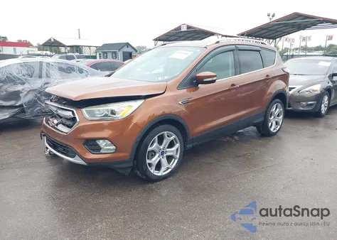 2017 Ford Escape Titanium z USA, uszkodzony, nr VIN 1FMCU9J99HUE29043